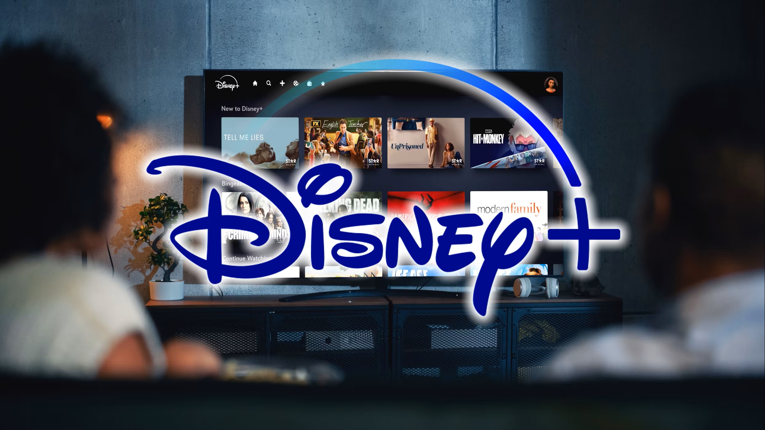 disney-plus-logo-with-people-watching-disney-plus-in-background.jpg